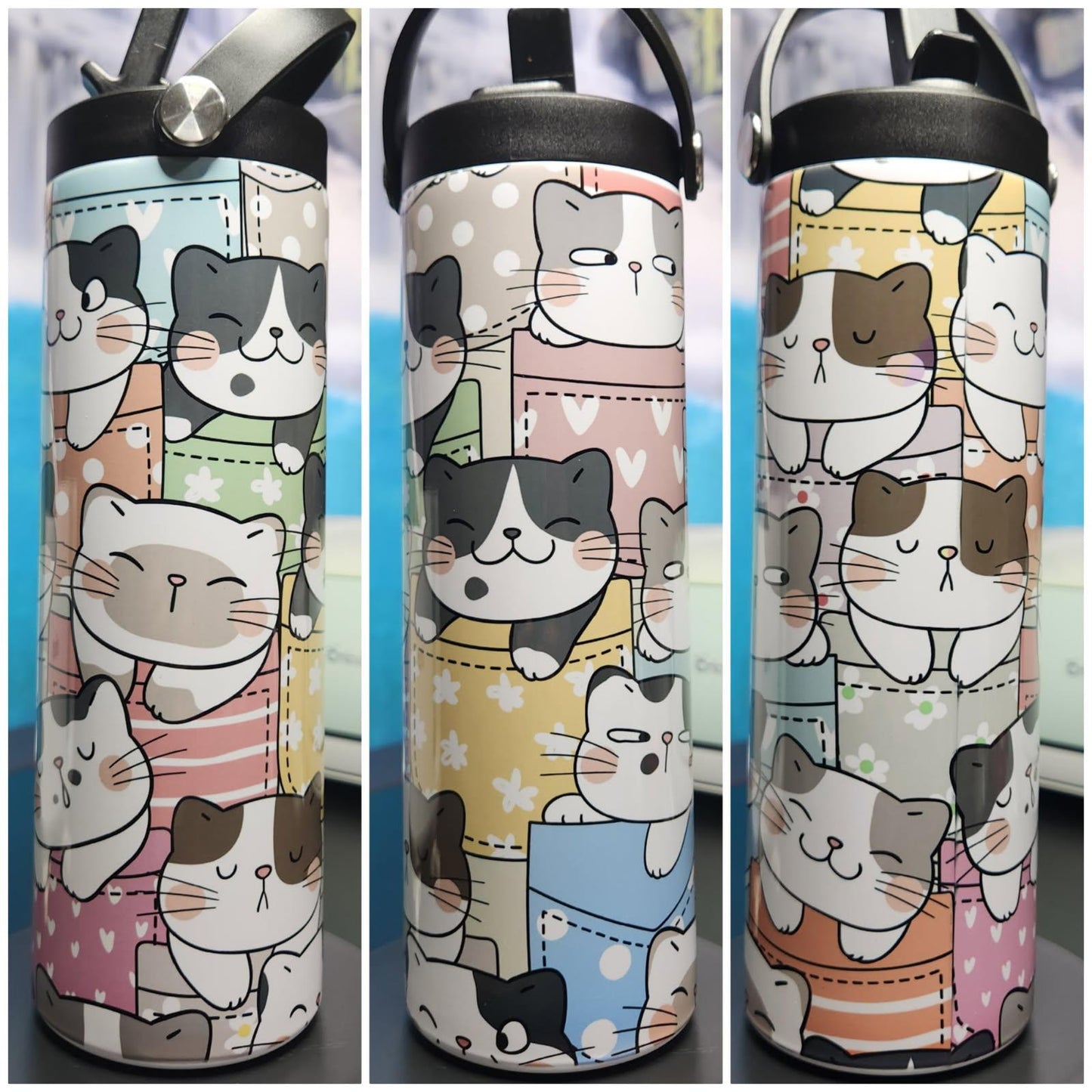 Three water bottles with cat-themed designs on a blurred background