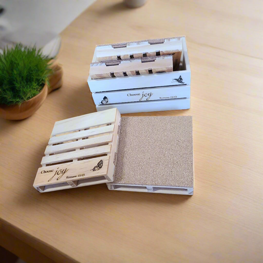 a crate and pallet coasters on a kitchen counter.