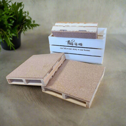 A crate with coasters around the crate.