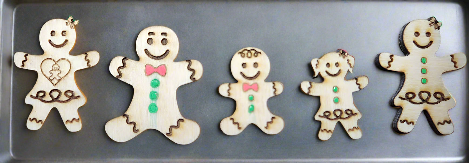 family of gingerbread figures on a cookie sheet