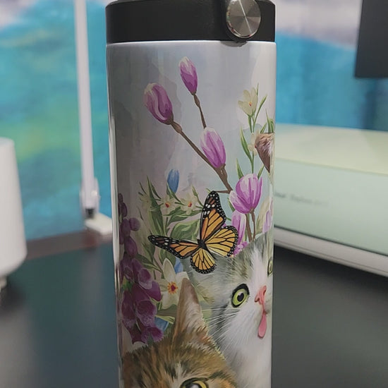 selfie cats 20oz tumbler with butterflies and the cats are making fun faces.